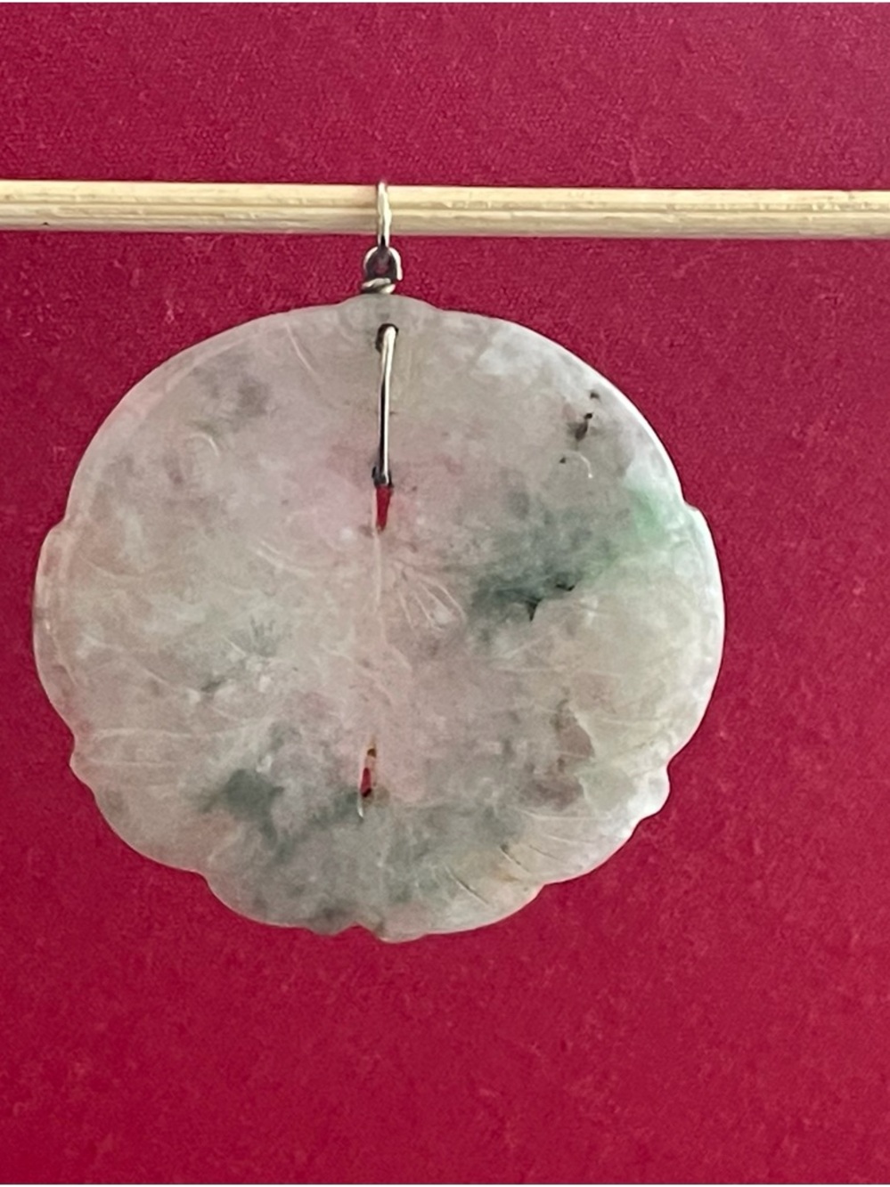 Carved jadeite double fish pendant.